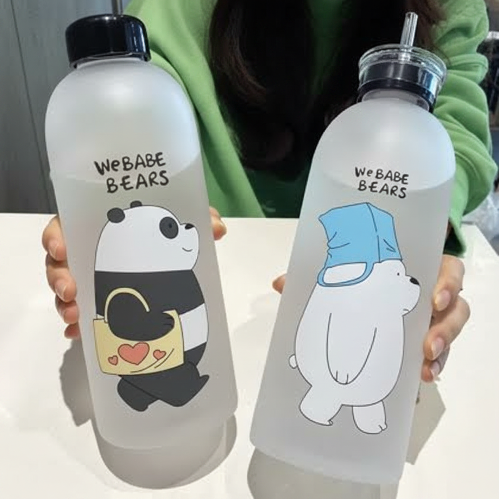 Two water bottles with cartoon pandas and text, held by a person wearing a green sweater with 'Jbi' branding.