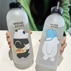 Two water bottles with cartoon pandas and text, held by a person wearing a green sweater with 'Jbi' branding.