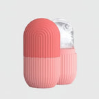 Pink and coral wireless earbuds case with clear lid on a light gray background, featuring the brand 'Jbi'.