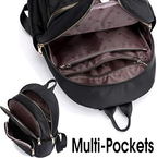 Black backpack with multiple pockets and zippers on a white background