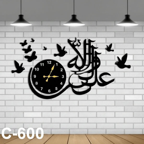 Decorative wall clock with Arabic calligraphy and birds on a white brick wall.