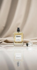 Perfume bottle labeled 'Legacy' on a reflective surface with a beige curtain background