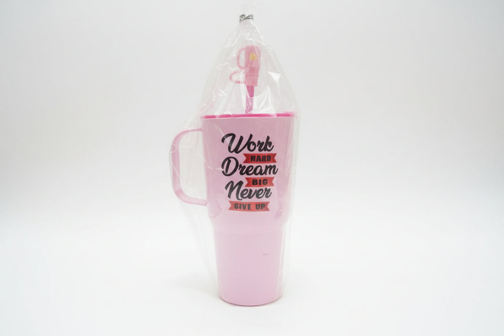 Pink mug with motivational quote in clear packaging on a blurred background
