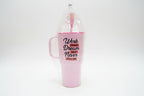 Pink mug with motivational quote in clear packaging on a blurred background