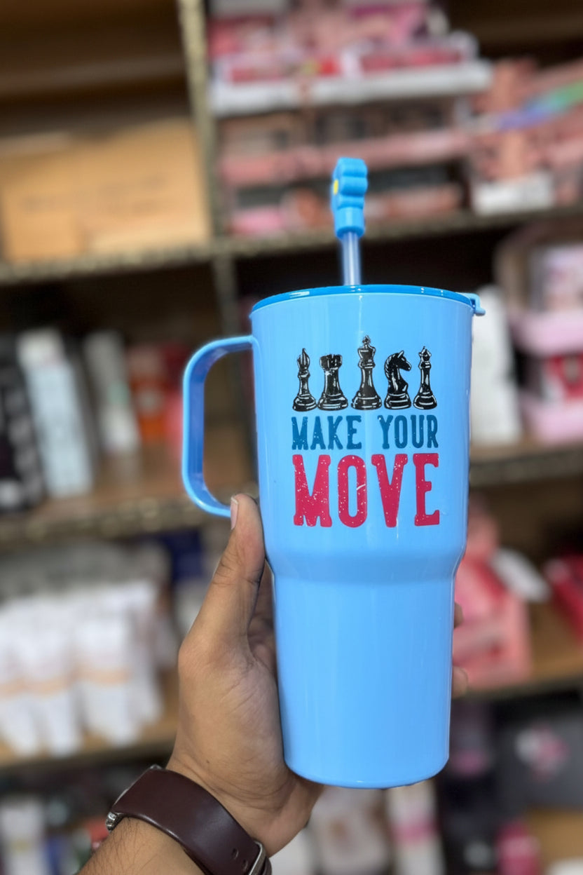 Blue tumbler with chess design and 'Make Your Move' text held in front of a store shelf.