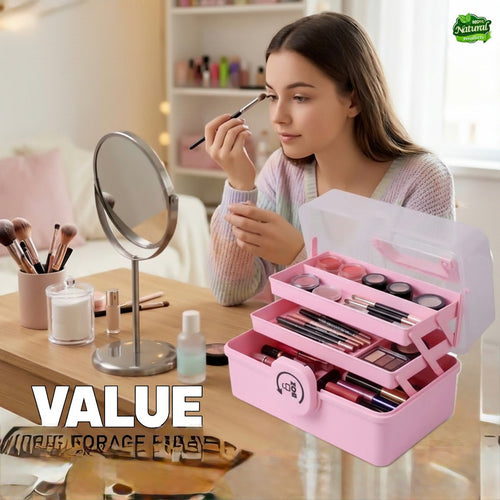 Woman applying makeup with a pink cosmetic case on a table, featuring the Jbi brand.