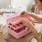 Pink jewelry storage box with a woman organizing jewelry, branded 'Jbi by Smart Deals'.