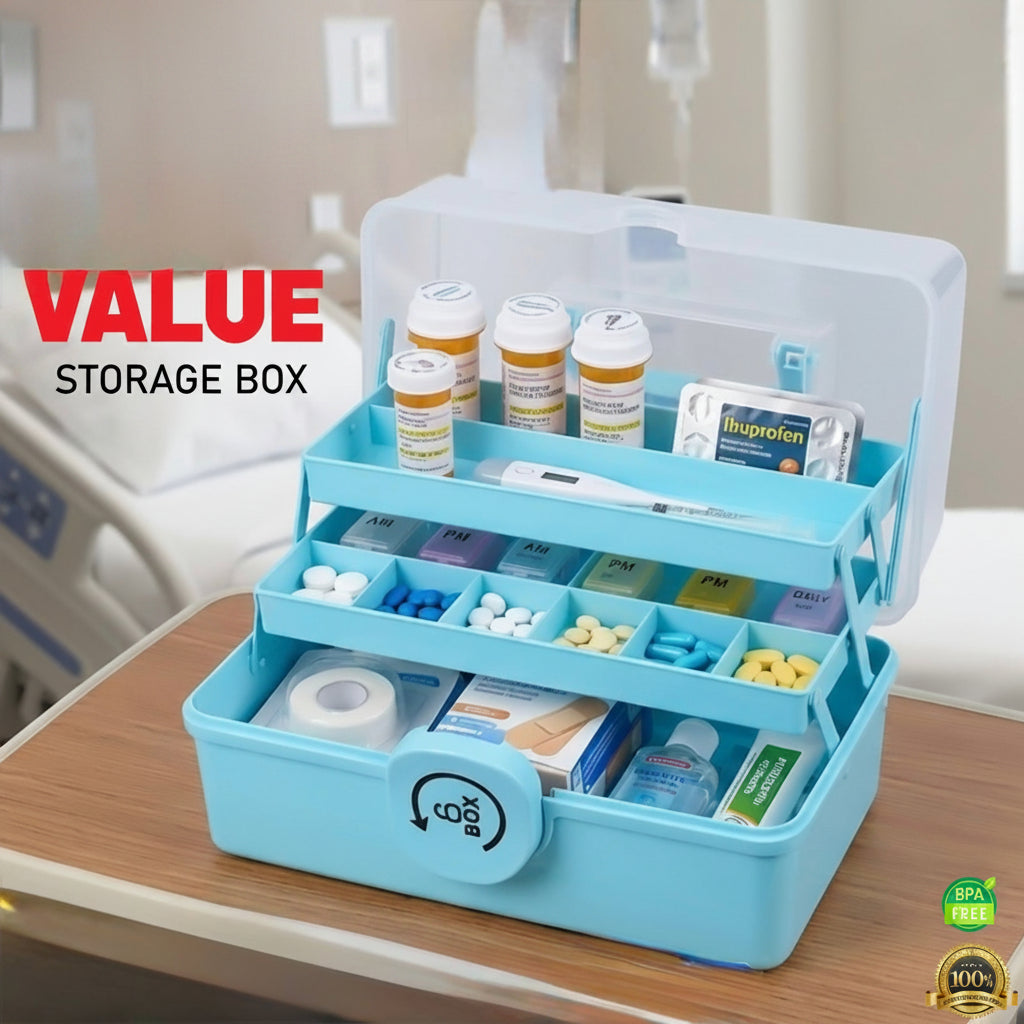 Blue medication storage box with various pills and containers on a wooden surface.